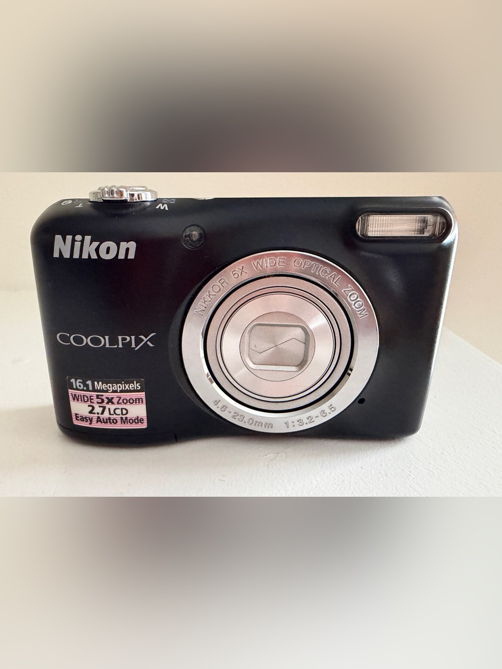 Nikon compact digital camera in black with silver lens ring
